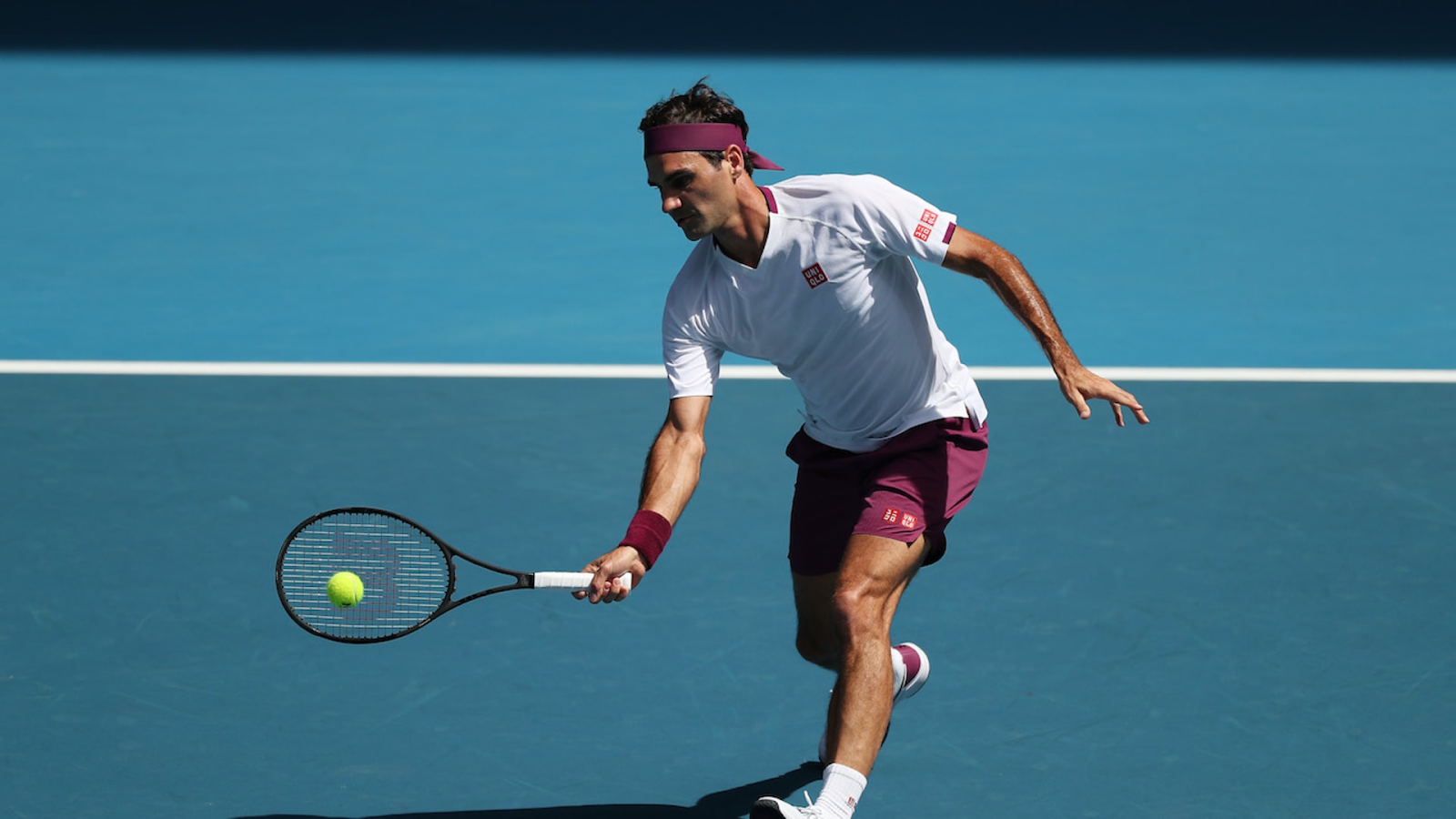 Roger Federer demonstrating a forehand volley with classic compact form — the model technique for ball machine volley practice